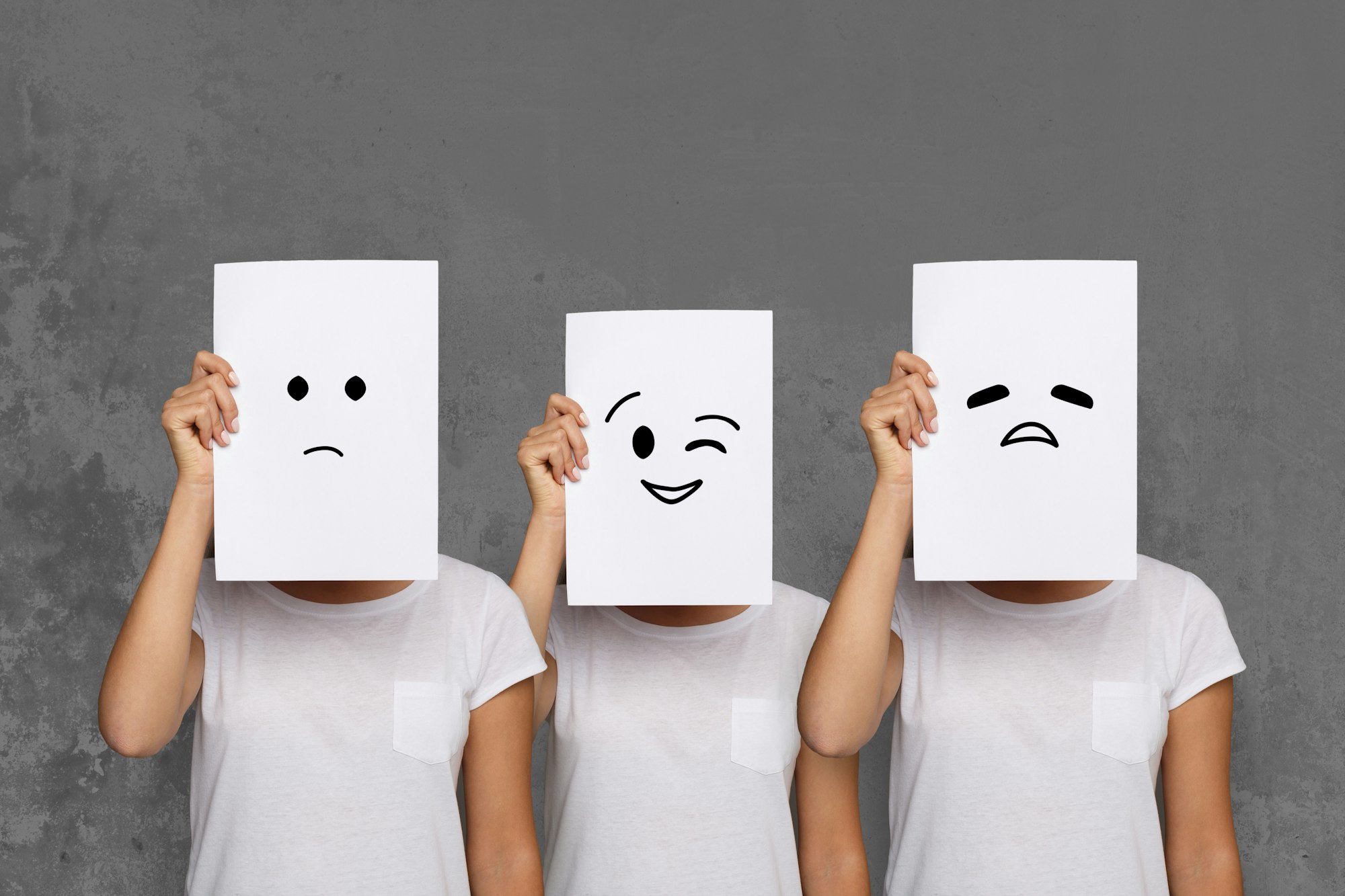 Girl covering face with white boards. Set of painted emotions